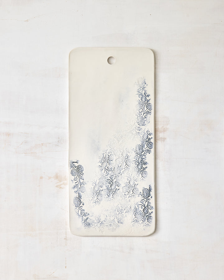 Handmade Kashmir charcuterie board in white porcelain with blue floral pattern, rectangular serving board for cheese, bread, and appetizers.