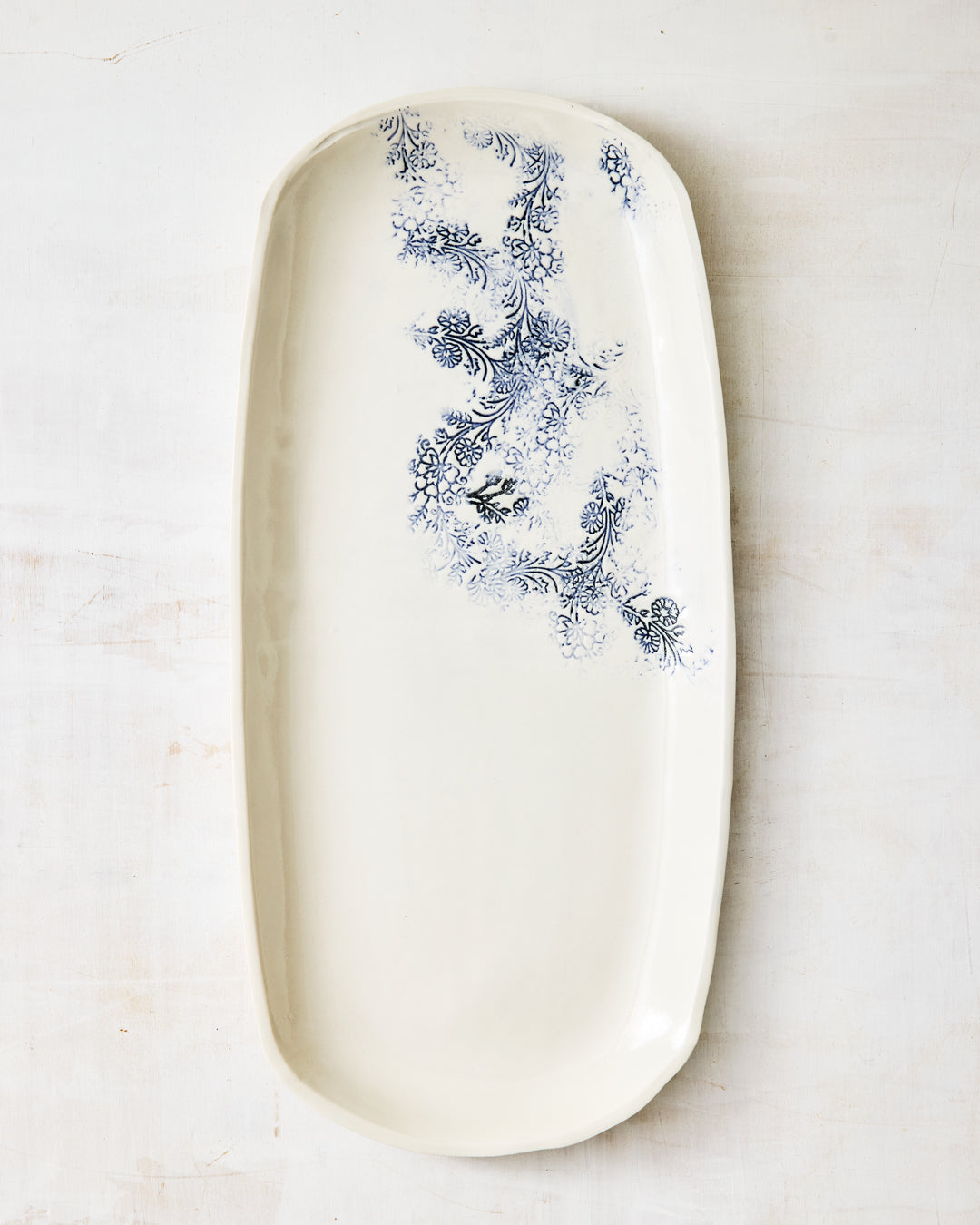 Handmade Kashmir long tray in white porcelain with blue floral pattern, elongated serving tray for entertaining and table display.”