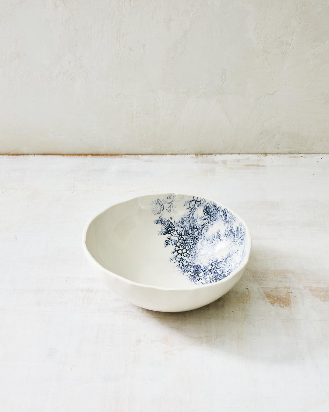 White porcelain Kashmir Noodle Bowl with blue indigo pattern, showing the bowl’s generous depth and organic shape.
