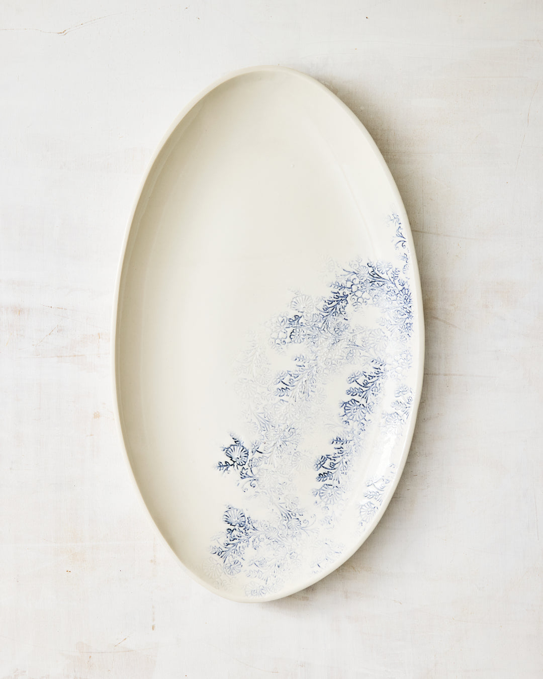 Kashmir oval serving platter in porcelain, finished with a soft blue floral design and elongated form.