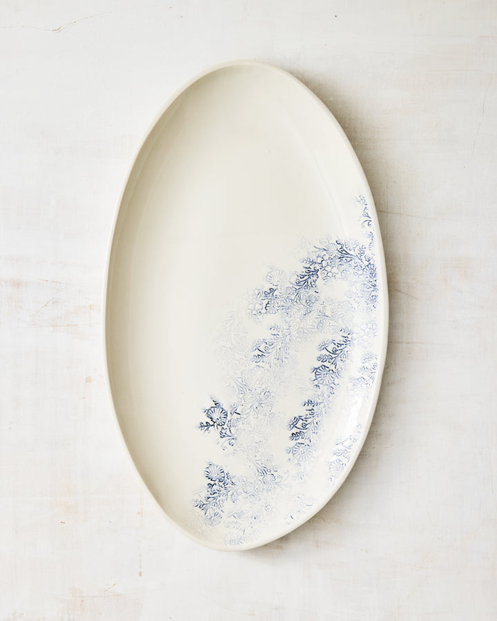 Kashmir oval serving platter in porcelain, finished with a soft blue floral design and elongated form.