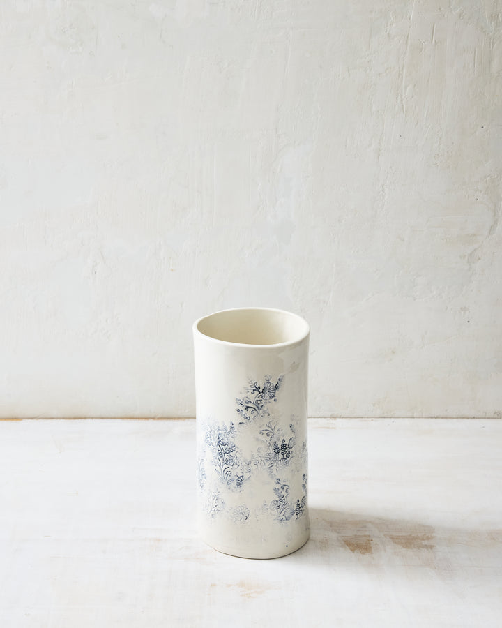Handcrafted Kashmir small porcelain vase featuring blue indigo floral motif on white glaze, decorative ceramic vase for fresh or dried flowers.