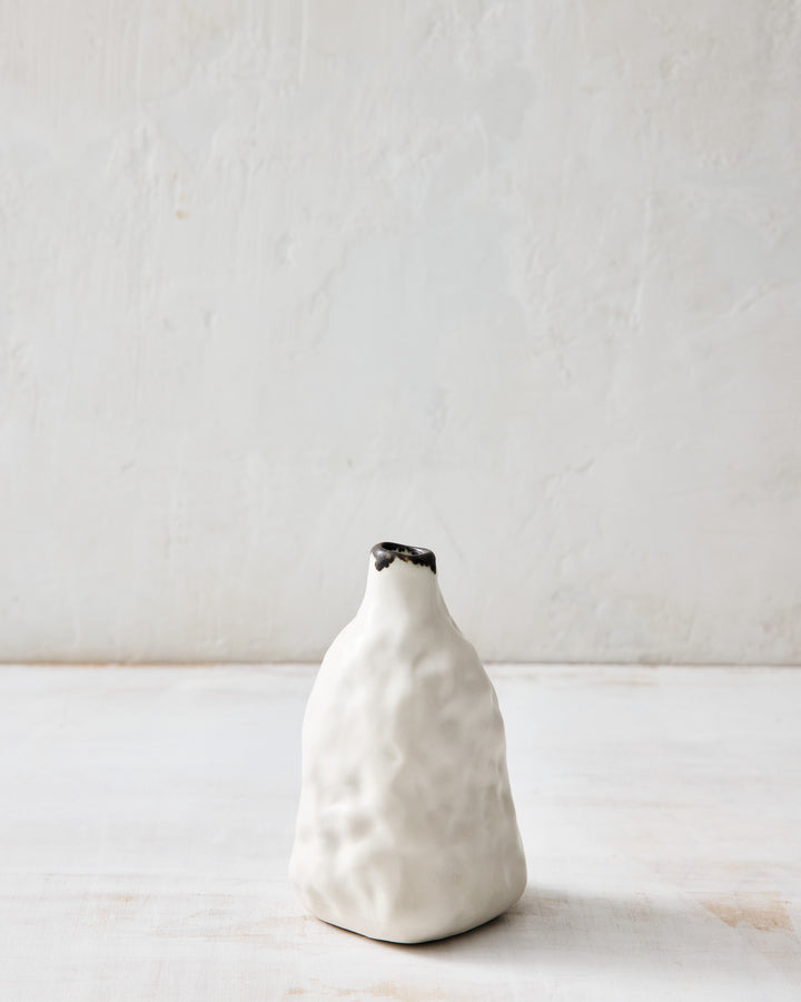 DBO HOME Pinch Bud Vase – John, a mid-height handmade porcelain vase with a subtly fluted silhouette and bronze-glazed mouth. Ideal for single stems or standing alone as a quiet statement.