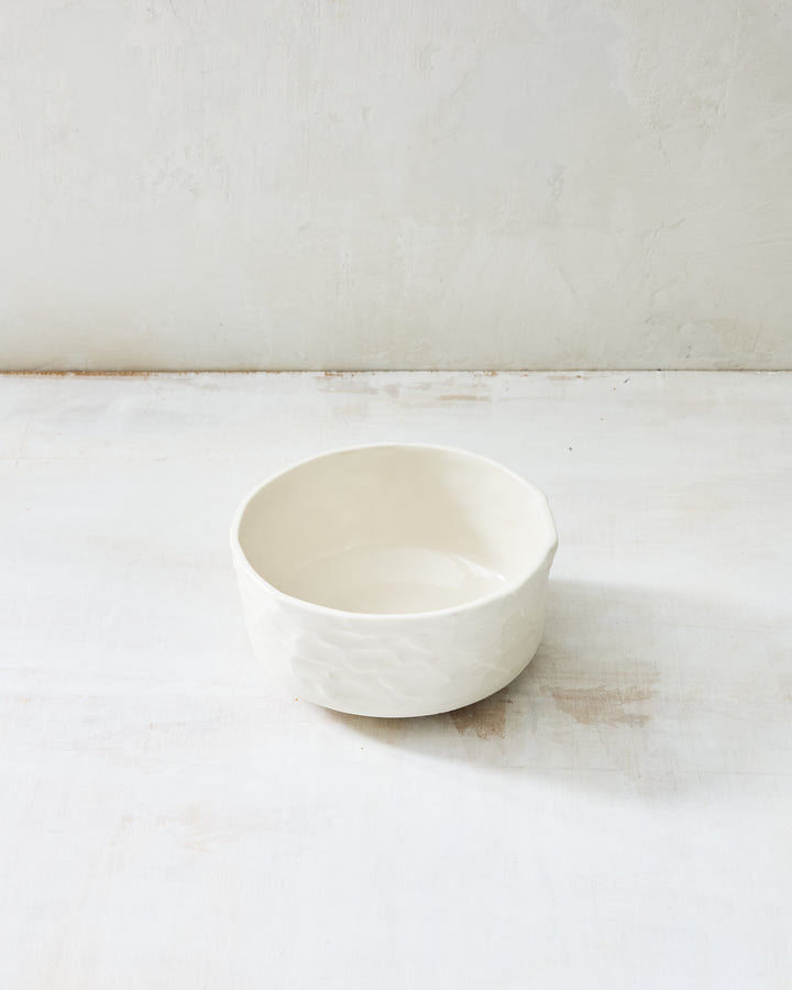 DBO HOME Stucco Straight Bowl in clear-glazed handmade porcelain with a straight-sided cylindrical form and tactile stucco-textured exterior, photographed on a whitewashed surface.