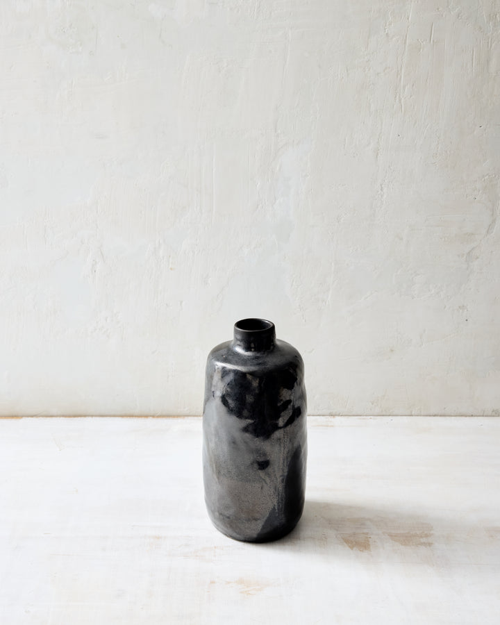 Medium Wabi ceramic vase in dark Granite glaze, showcasing a smoky charcoal and gray surface with organic variation, handcrafted form, and minimalist studio styling.