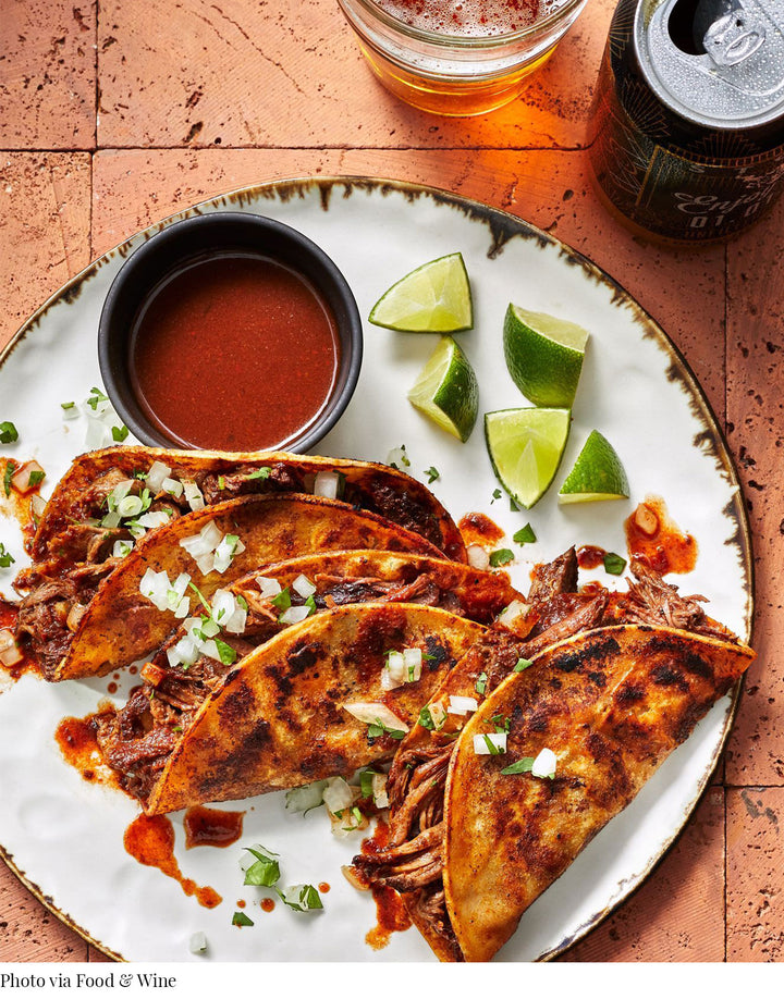DBO HOME Pinch Plate with Birria Tacos and lime wedges via Food & Wine